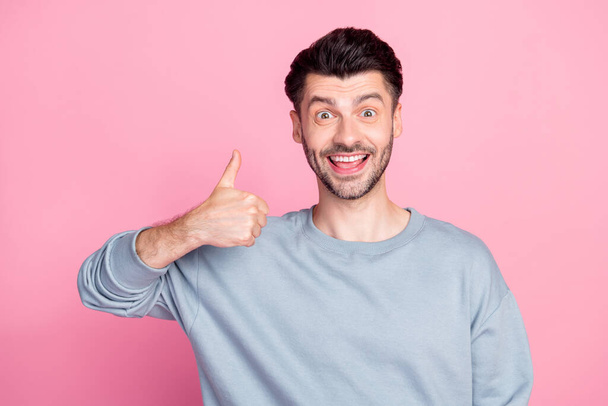 Portrait of positive cheerful man hand finger demonstrate thumb up isolated on pink color background. - Fotografie, Obrázek