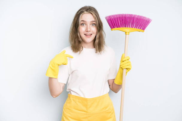 caucasian pretty woman feeling happy and pointing to self with an excited. housekeeper cleaning concept - Zdjęcie, obraz