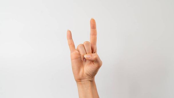 sign language of the deaf and dumb, phrase - rock and roll, rock on. High quality photo - Фото, изображение
