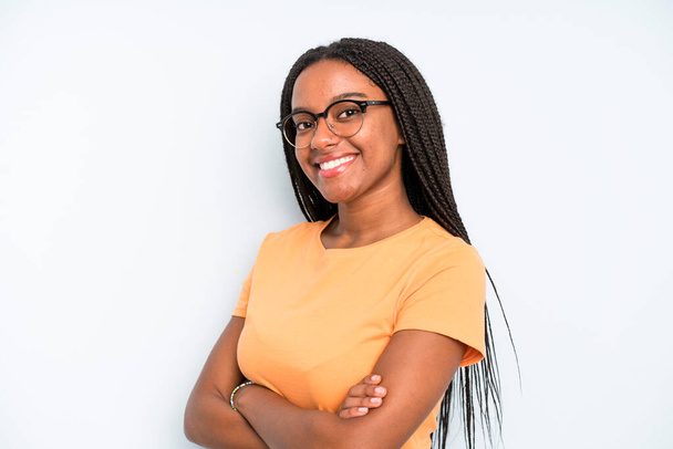black young adult woman smiling to camera with crossed arms and a happy, confident, satisfied expression, lateral view - Fotoğraf, Görsel