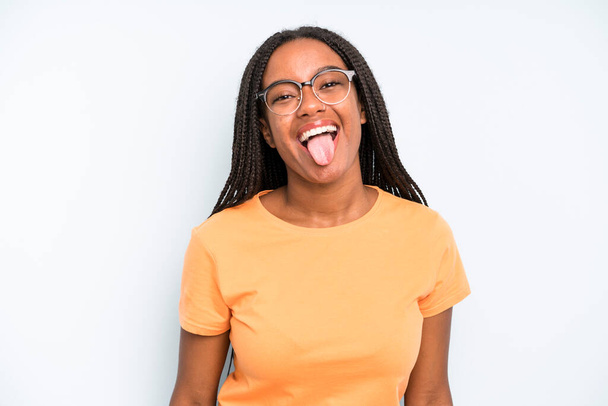 black young adult woman with cheerful, carefree, rebellious attitude, joking and sticking tongue out, having fun - Foto, immagini