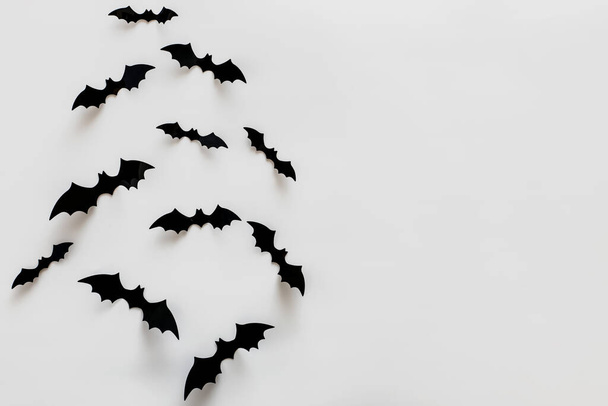 Bat silhouettes on the white wall with copy space. Minimalist Halloween decor - Foto, afbeelding