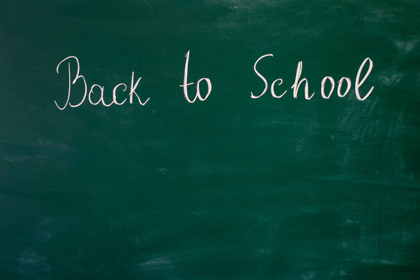 Blackboard at school, on which is written in chalk Back to school - Photo, image