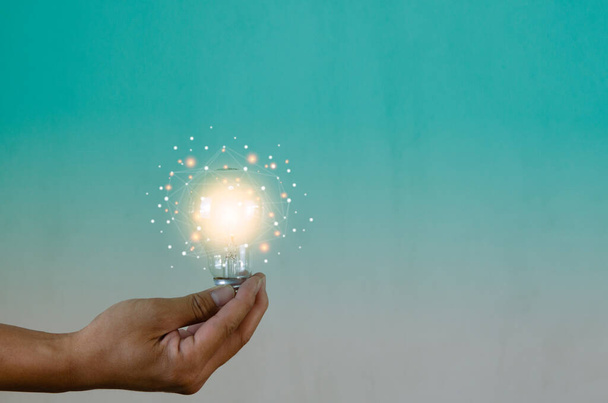 Man holding light bulbs ideas innovation technology and creative business concept. - Foto, Bild