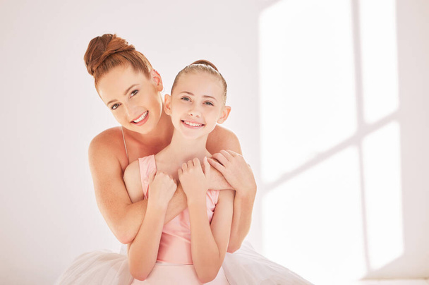 Portrait ballet teacher and child hug in studio with happy smile and support after training. Happy woman and girl after learning dance and creative theater art after practice lesson or training. - Foto, Imagem