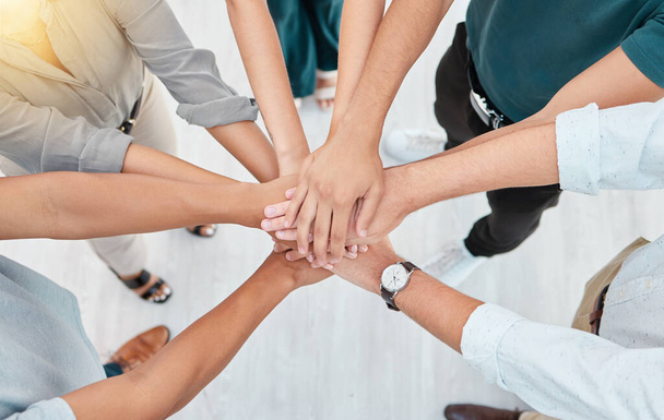 Support, trust and collaboration of business people pile hands together in agreement of partnership in an office. Teamwork, team building and celebrating company growth and diversity. - Foto, afbeelding