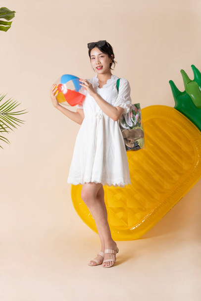 summer vacation trip with friends concept series_korean beautiful asian young woman holding a pool float ball - Photo, image
