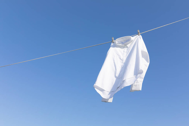 aesthetic laundry concept_shirts hung on a clothesline - Foto, immagini
