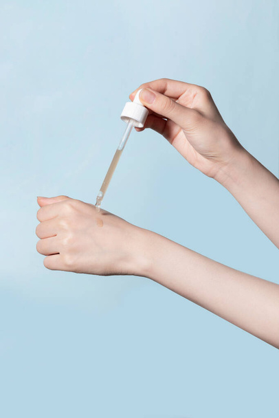 beauty hands motion series_using ampoule serum - Photo, image