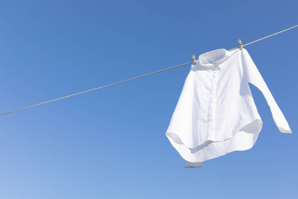 aesthetic laundry concept_shirts hung on a clothesline - Fotoğraf, Görsel