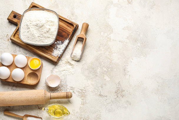 Ingredients for baking and rolling pin on light background - Zdjęcie, obraz