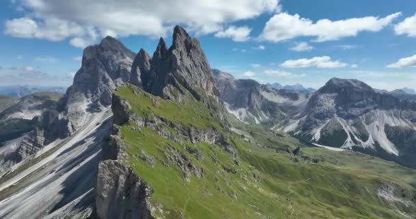 The Dolomites mountain range Italy part of the Southern Limestone Alps. Mountain aerial Hiking trekking majestic rugged cliffs with green grass. Unesco world heritage landscape. - Video