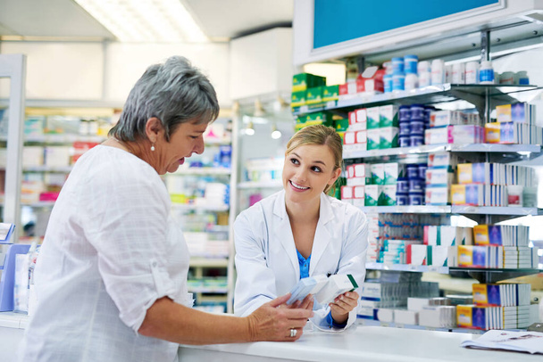 Can I recommend this. a young pharmacist assisting a customer - Photo, Image