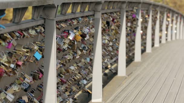 Padlocks of love on a bridge in Paris. Establishing shot - Footage, Video