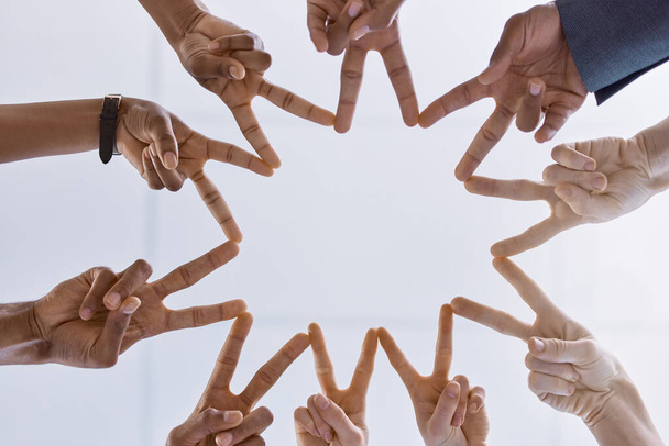 Peace, teamwork and support or collaboration of business people hands or finger as symbol of their partnership and trust. Diversity, friends and corporate company workers making star working together. - Foto, Bild