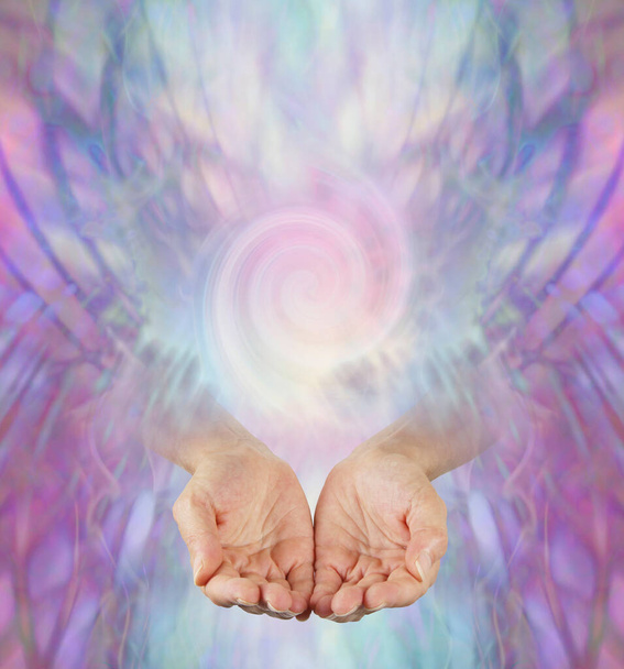 Offering you Vortex Energy Healing - female hands open cupped emerging from purple lilac web background with a double spiral and space for text - 写真・画像