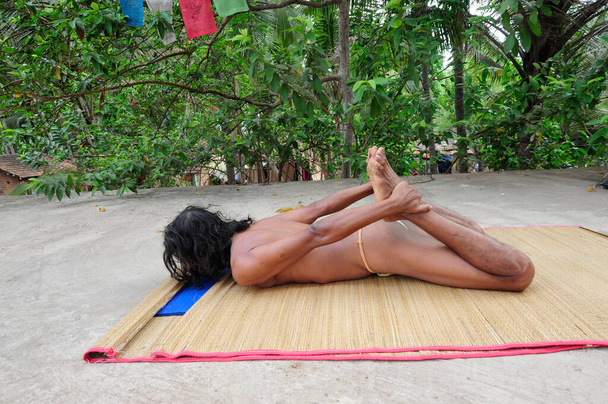 dhanurasana or bow pose, a back bending exercise in yoga - Foto, Imagem