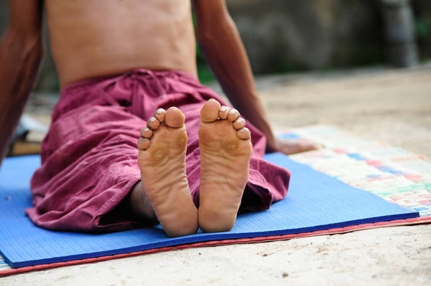 feet and ankle during a yoga session, exercise and training - Photo, Image