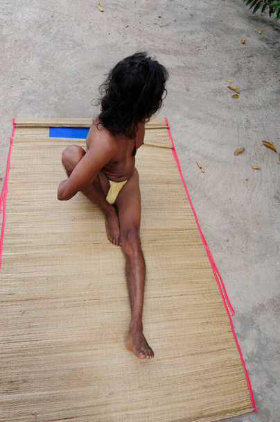 marichyasana or marichi pose, a sitting twist exercise in yoga - Fotó, kép