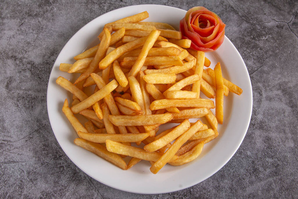 French fries on a rustic background - Zdjęcie, obraz