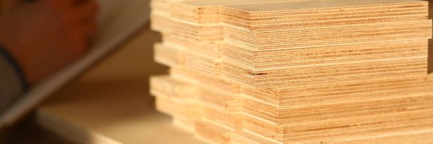 Plank board closeup. Wood plank panel for construction and production furniture. Wood chipboard cutting board warehouse - Photo, image