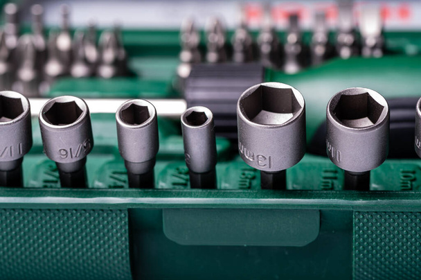 Interchangeable screwdriver set with different types of metal steel heads and bits, selective focus - Photo, image