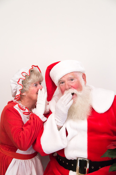 Sra. Claus conta um segredo ao Pai Natal
 - Foto, Imagem
