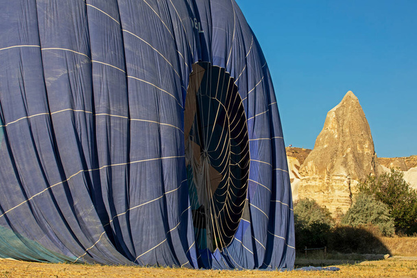 hot air balloon landed on the ground in Cappadocia, on the goreme  - Valokuva, kuva