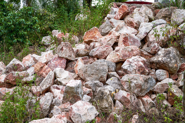 Large piles of rubble produced by blasting mountains in the wild - Foto, imagen