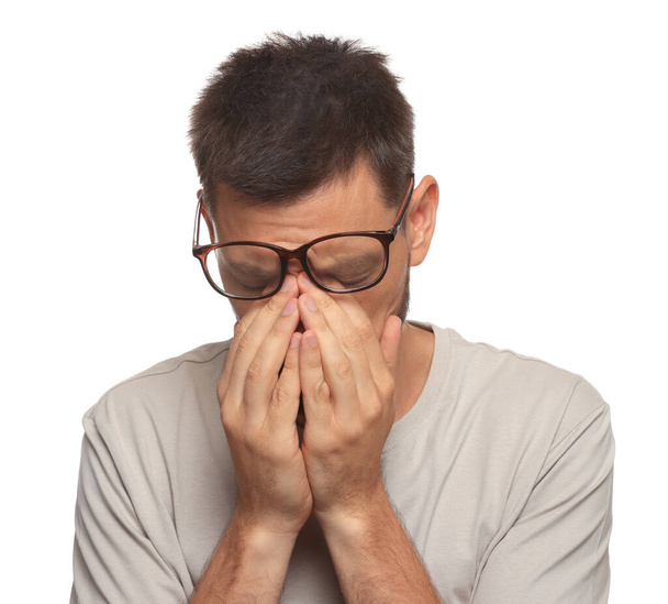 Man suffering from eyestrain on white background - Photo, Image