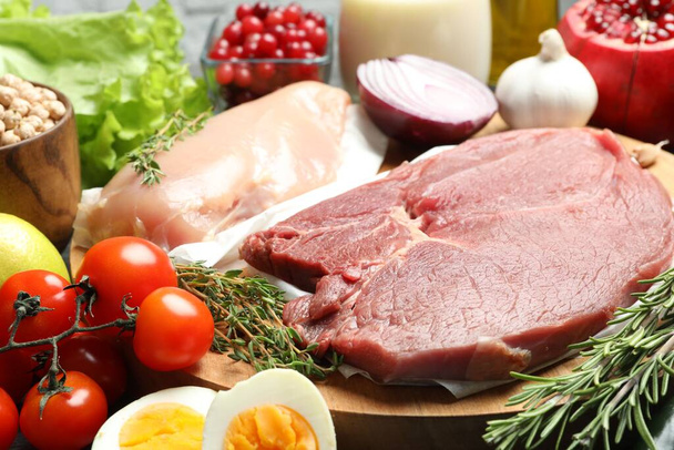 Fresh meat and other products for balanced diet on table - Фото, изображение