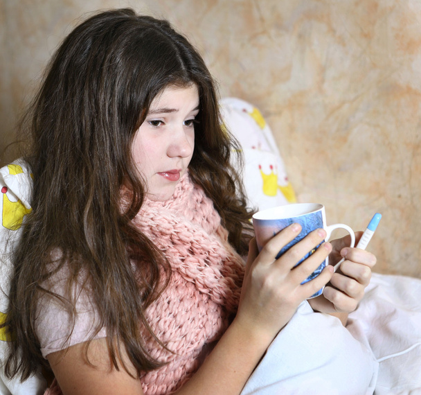 beautiful teen girl with long dark hair sick in bed  - Foto, Bild