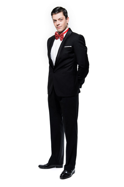 New year's eve fashion man wearing black dinner jacket with big  - Foto, imagen