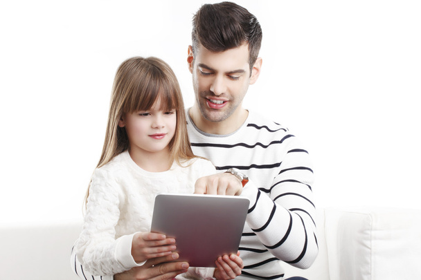 Girl with dad looking at tablet - Φωτογραφία, εικόνα