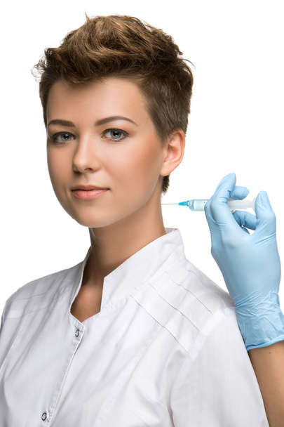 pretty young woman and vaccine syringe - Foto, Imagen
