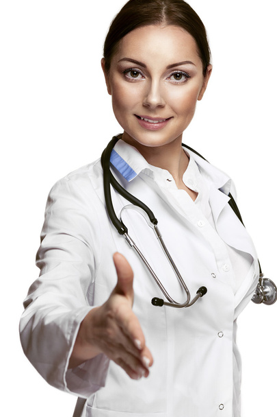 Жінка-лікар дає руку для рукостискання
 - Фото, зображення