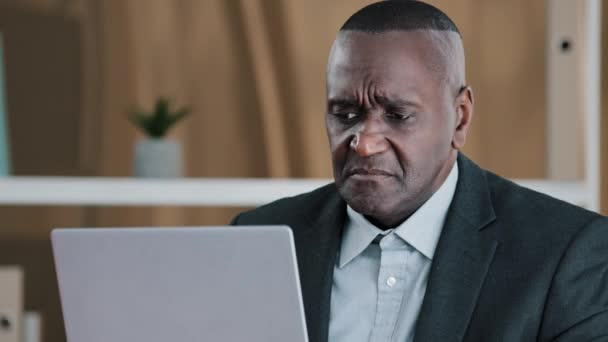 Upset frustrated African American adult old senior mature businessman elderly citizen man looking in laptop screen with sad lost failure suddenly female hands give money dollars banknote finance prize - Video