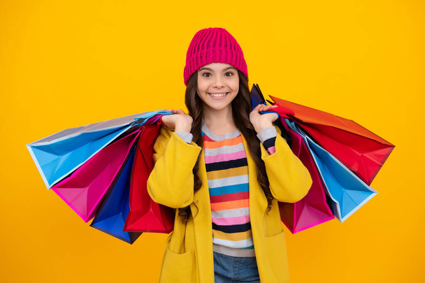 Teenager hold shopping bag enjoying sale. Autumn shopping sale. Child girl is ready to go shopping. Happy teenager, positive and smiling emotions of teen girl - Φωτογραφία, εικόνα