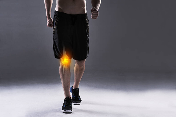 You cant run with a knee injury. a young man in the studio with cgi highlighting his knee injury - Photo, Image