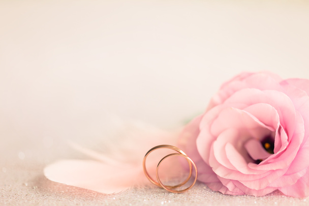 Wedding  Background with gold Rings, gentle flower and light pin - Photo, Image