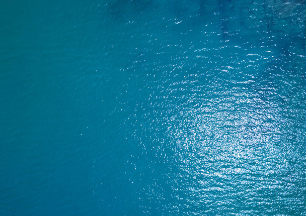 Sea surface aerial view,Bird eye view photo of blue waves and water surface texture Blue sea background Beautiful nature Amazing seascape - Foto, Imagen