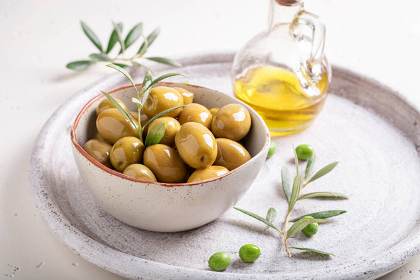 Tasty and healthy olives as a summer snack. Products made of olives. - Foto, Imagen