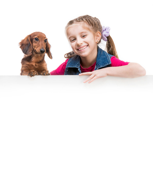 little girl  with dachshund - Фото, зображення