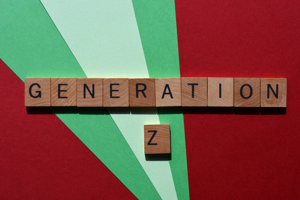 Generation Z, people born between 1995 and 2010, words in wooden alphabet letters isolated on colour background - 写真・画像