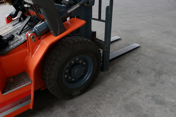 Forklifts or fork trucks are industrial trucks that are used to lift and move materials but are limited to short distances and certain lifting heights - Zdjęcie, obraz