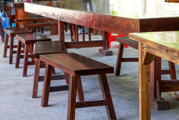 Long table and wooden benches in traditional Chinese restaurant - Foto, Imagen