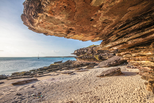 yacht anchoring in front of spectacular rock formation in Two Island Bay, Cape Wessel, northern Territory, Australia. May be the most remote spot on the australian continent - Photo, Image