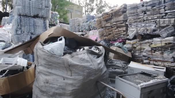 Big Sacks And Plastics Of Waste Put Together In A Shelter With Roof In Hongkong. -wide shot - Metraje, vídeo