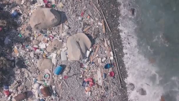 Climate change is impacted by beach covered in plastic and rubbish in Hong Kong. Aerial drone view - Materiaali, video