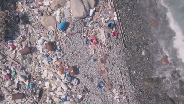 Environmental issues shown by beach covered in plastic and rubbish in Hong Kong. Static aerial drone view - Metraje, vídeo